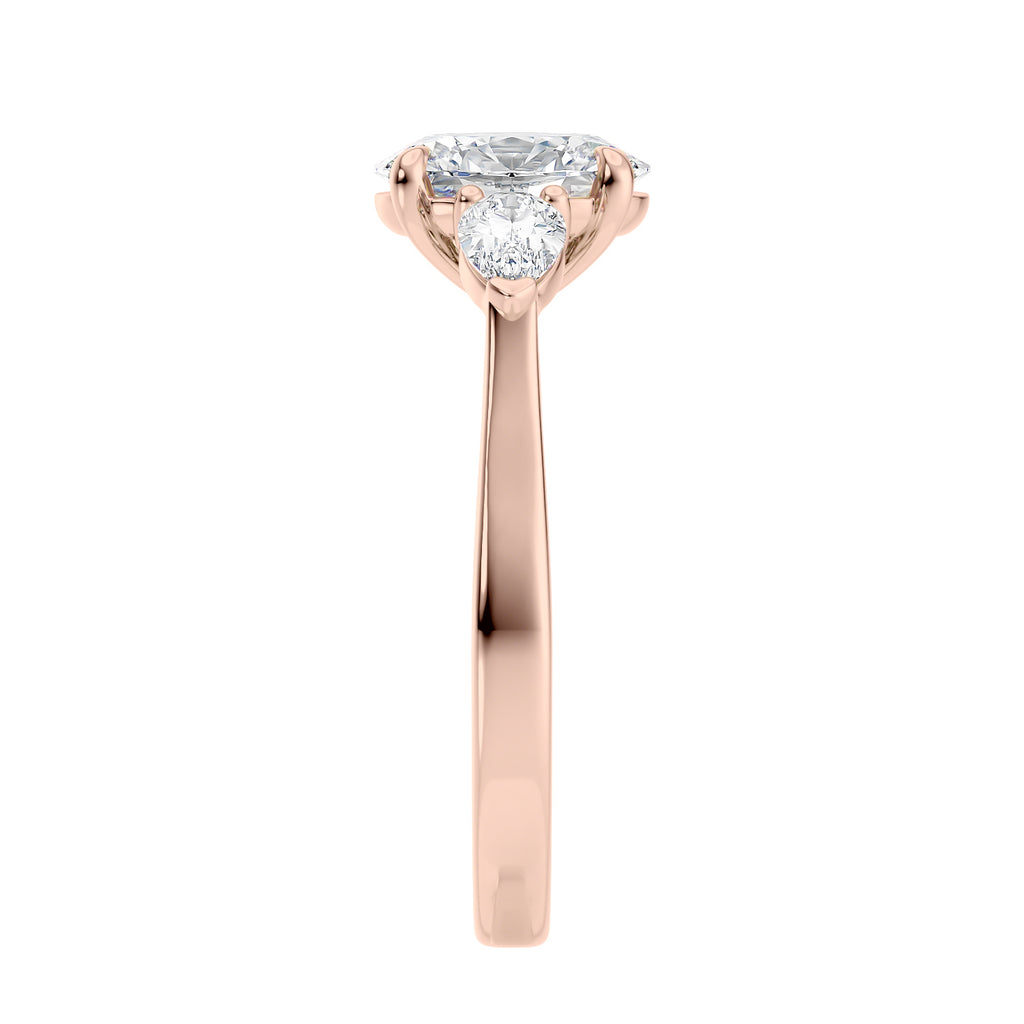 Oval natural diamond 3 stone engagement ring with pear shaped side stones 18ct rose gold end view.