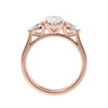 Oval natural diamond 3 stone engagement ring with pear shaped side stones 18ct rose gold side view.