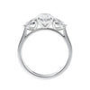 Oval natural diamond 3 stone engagement ring with pear shaped side stones white gold side view.