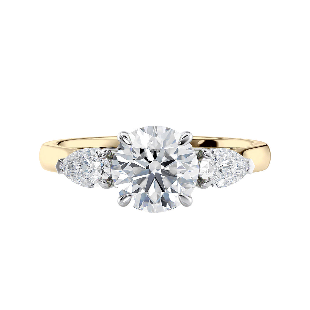 Lab grown diamond trilogy style engagement ring with pear sides gold front view.