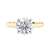 Classic round solitaire engagement ring in 18ct yellow gold front view.