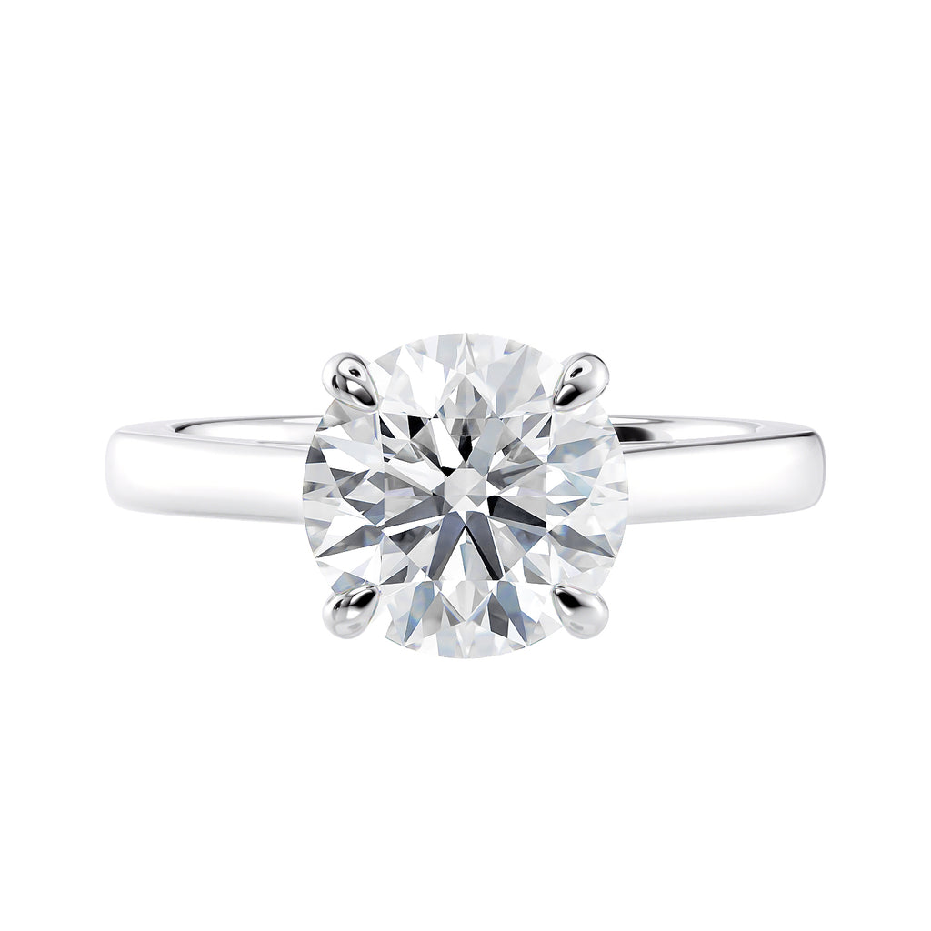 Classic round solitaire engagement ring in white gold front view.