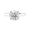 Classic round solitaire engagement ring in white gold front view.