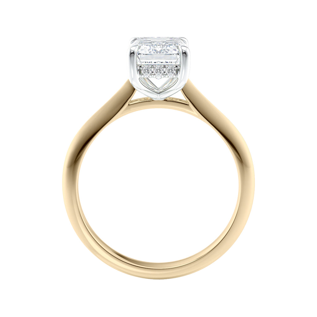 Emerald cut diamond hidden halo engagement ring 18ct gold side view.