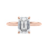 Emerald cut diamond hidden halo engagement ring 18ct rose gold front view.