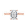 Emerald cut diamond hidden halo engagement ring 18ct rose gold front view.