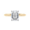 Emerald cut diamond hidden halo engagement ring 18ct gold front view.