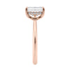 Emerald cut diamond hidden halo engagement ring 18ct rose gold end view.