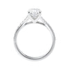 Oval diamond engagement ring with diamond set twist style band white gold side view.