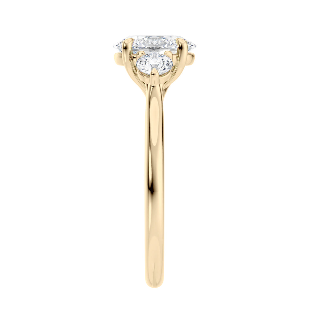 Oval diamond 3 stone engagement ring with small side diamonds 18ct gold end view.