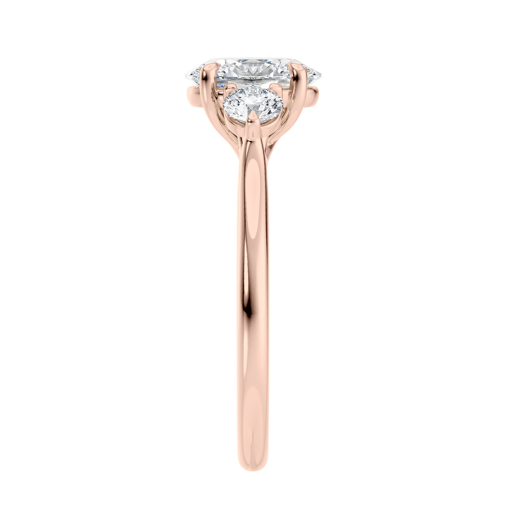 Oval diamond 3 stone engagement ring with small side diamonds rose gold end view.