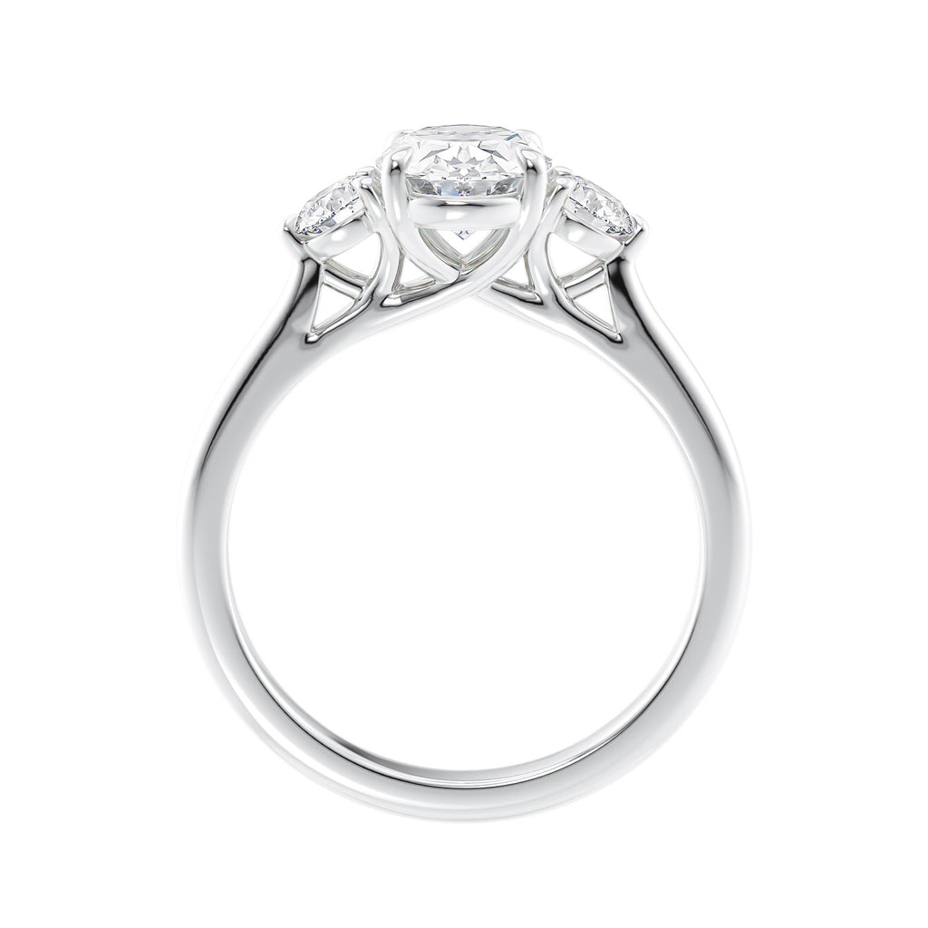 Oval diamond 3 stone engagement ring with small side diamonds 18ct white gold side view.