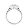 Oval diamond 3 stone engagement ring with small side diamonds 18ct white gold side view.