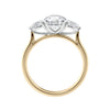 Lab grown diamond trilogy style engagement ring with pear sides gold side view.