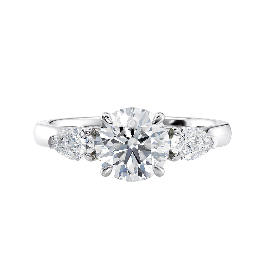 Lab grown diamond trilogy style engagement ring with pear sides white gold front view.