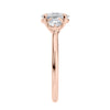 Laboratory grown diamond oval three stone diamond engagement ring with round side stones 18ct rose gold end view.