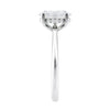 Lab grown diamond oval solitaire engagement ring with hidden halo white gold end view.