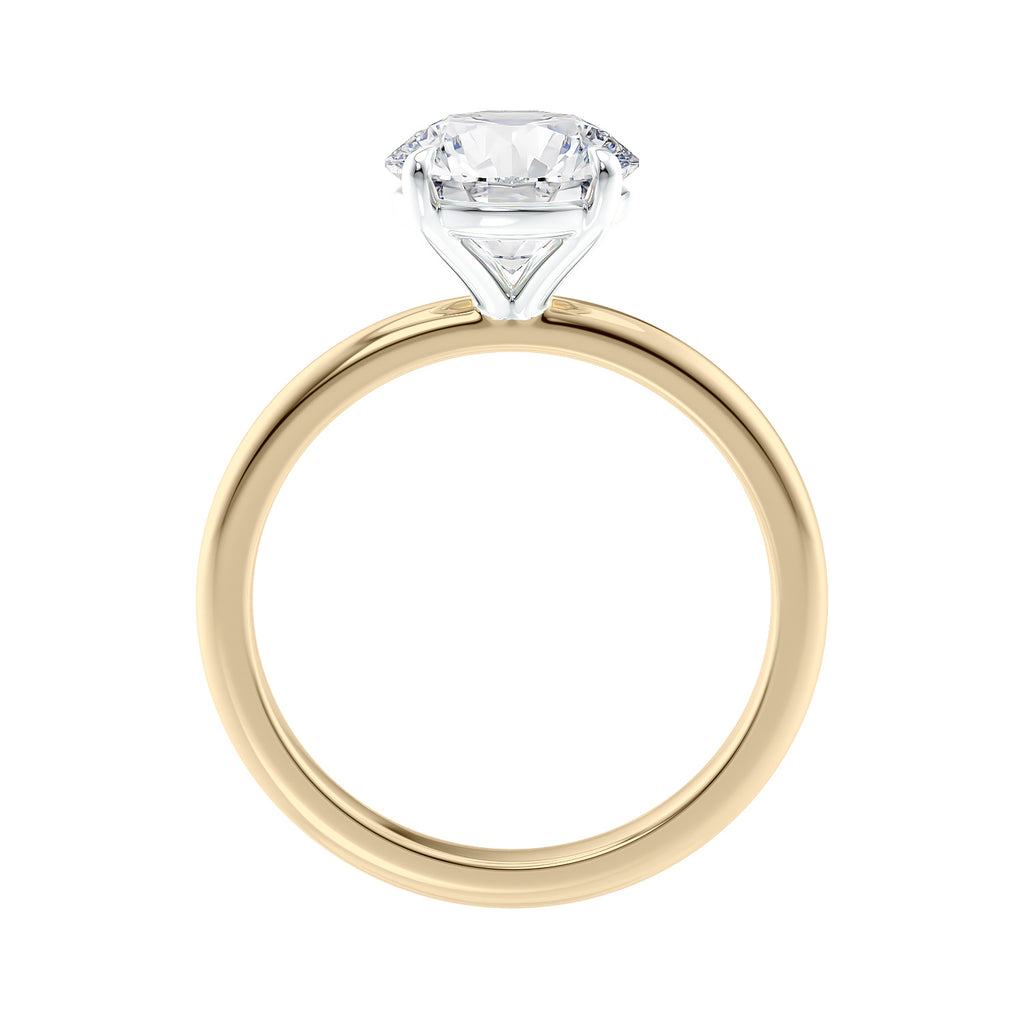 Round brilliant solitaire natural diamond engagement ring in yellow gold side view.