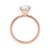 Round brilliant solitaire natural diamond engagement ring with a rose gold band side view.