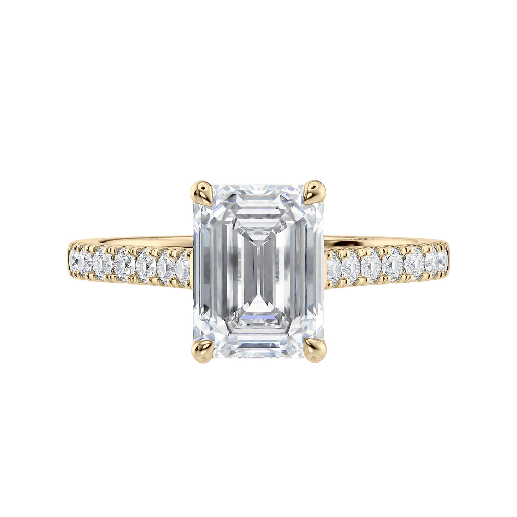 Emerald cut mined diamond engagement ring with castle set diamond band 18ct gold front view.