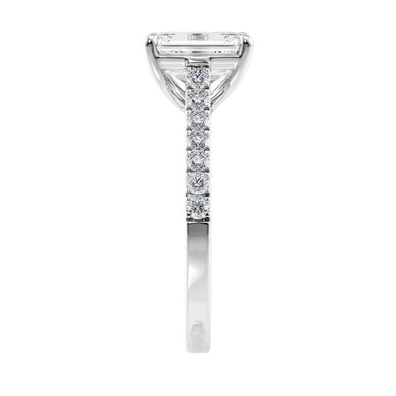 Emerald cut mined diamond engagement ring with castle set diamond band 18ct white gold end view.