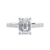 Emerald cut mined diamond engagement ring with castle set diamond band 18ct white gold front view.