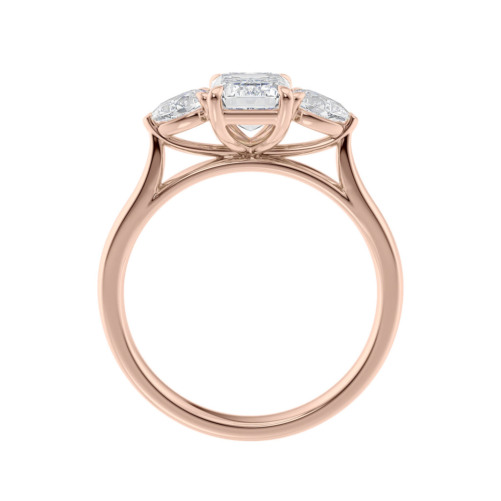 1 carat emerald cut with pear cut sides diamond engagement ring 18 rose gold side view.
