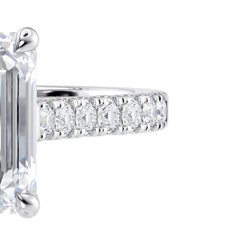 Emerald cut diamond engagement ring. Made in platinum with a diamond set band.