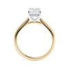 Emerald cut lab grown diamond hidden halo engagement ring 18ct gold side view.