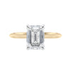 Emerald cut lab grown diamond hidden halo engagement ring 18ct gold front view.