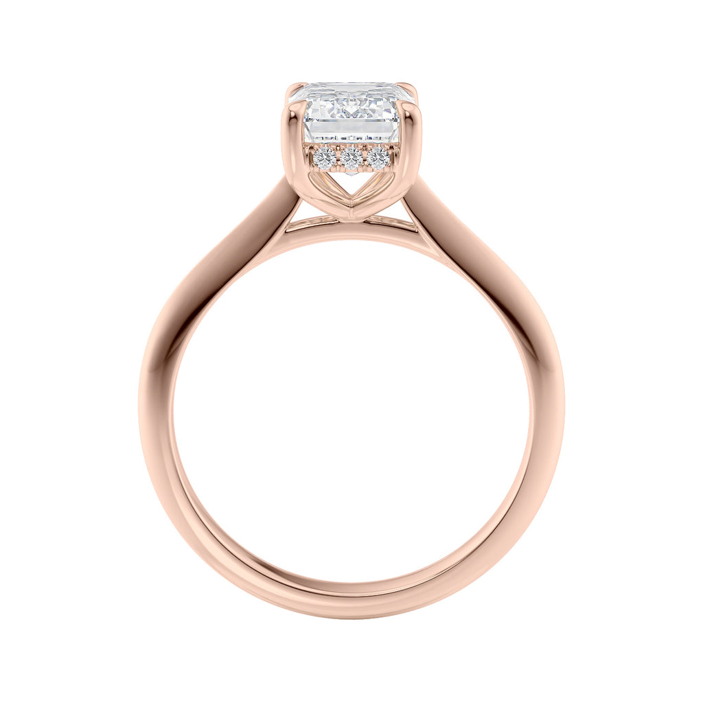 Emerald cut lab grown diamond hidden halo engagement ring 18ct rose gold side view.
