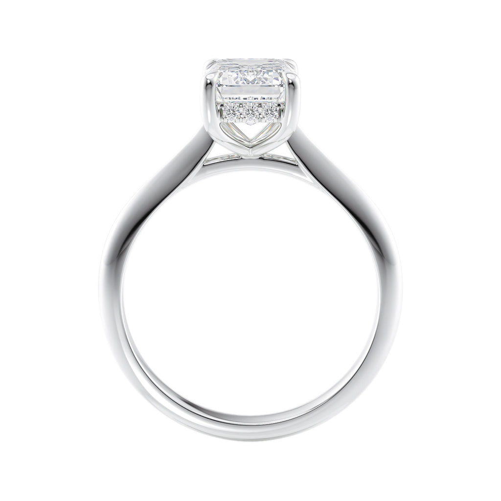 Emerald cut lab grown diamond hidden halo engagement ring white gold side view.