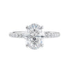 Laboratory grown diamond oval solitaire engagement ring with slim diamond band white gold front view.