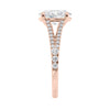 Oval cut diamond engagement ring with diamond set split band rose gold end view.