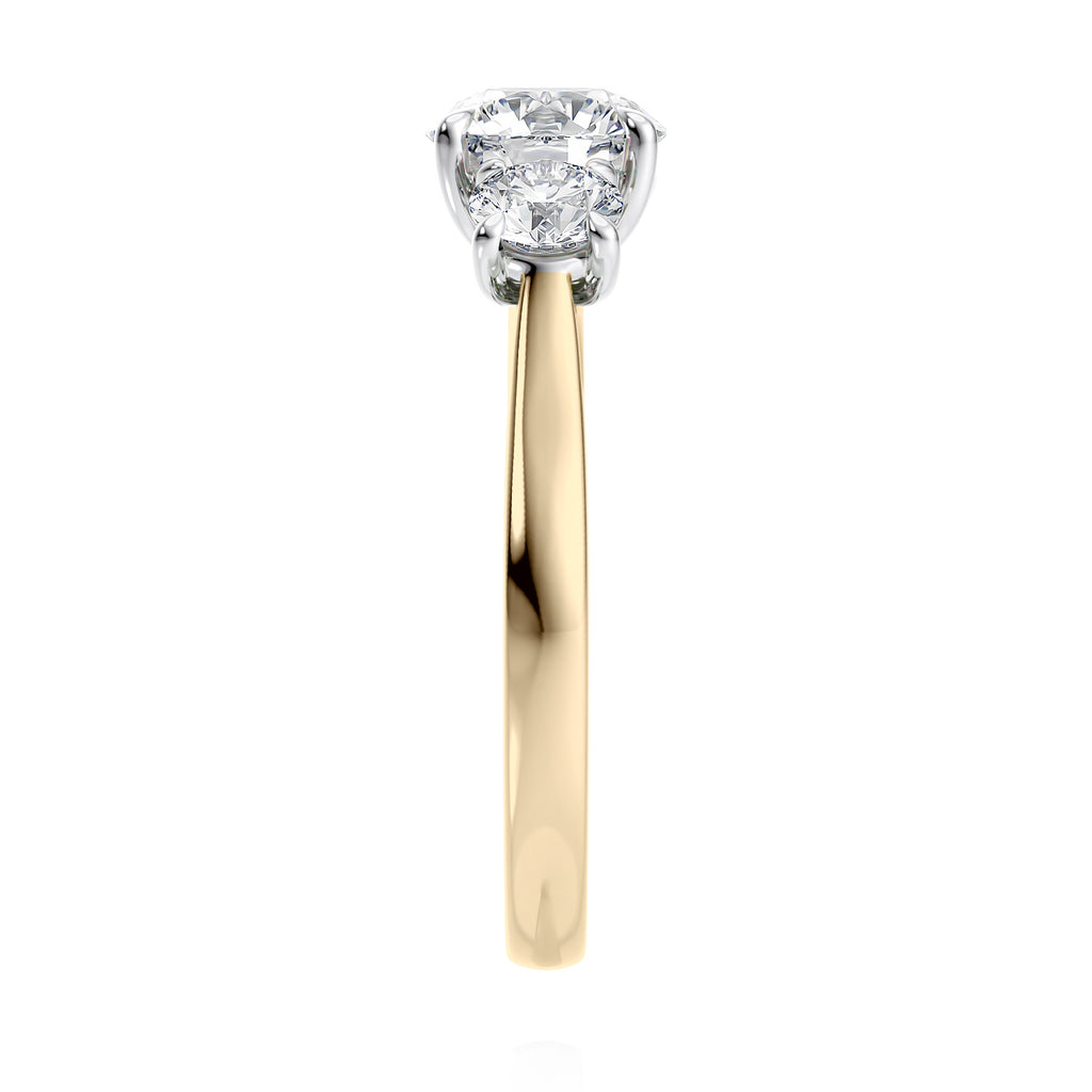 Round brilliant cut 3 stone diamond engagement ring 18ct gold and platinum end view.