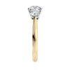 Round brilliant cut 3 stone diamond engagement ring 18ct gold and platinum end view.