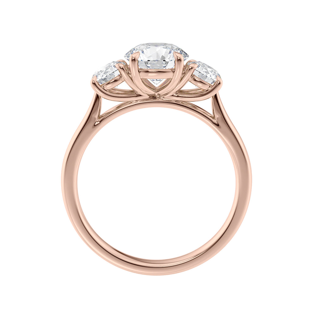 Round brilliant cut 3 stone diamond engagement ring 18ct rose gold side view.