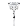 Emerald cut 3 stone diamond engagement ring 18ct white gold end view.