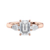 Emerald cut diamond engagement ring with pear sides 18ct rose gold front view.