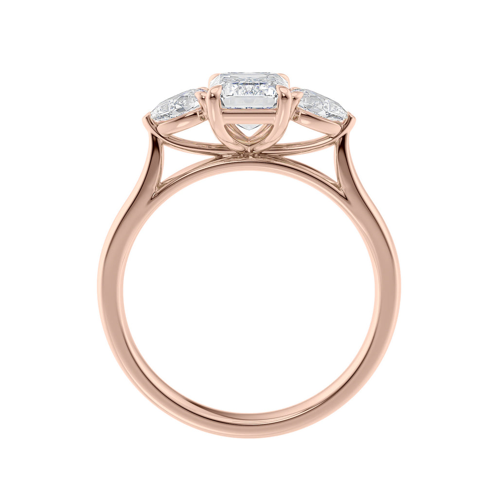 Emerald cut diamond engagement ring with pear sides 18ct rose gold side view.