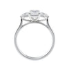 Emerald cut diamond engagement ring with pear sides white gold side view.