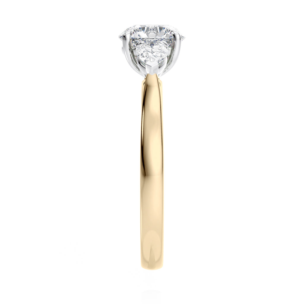 Round 3 stone natural diamond engagement ring with pear shoulders in gold end view.