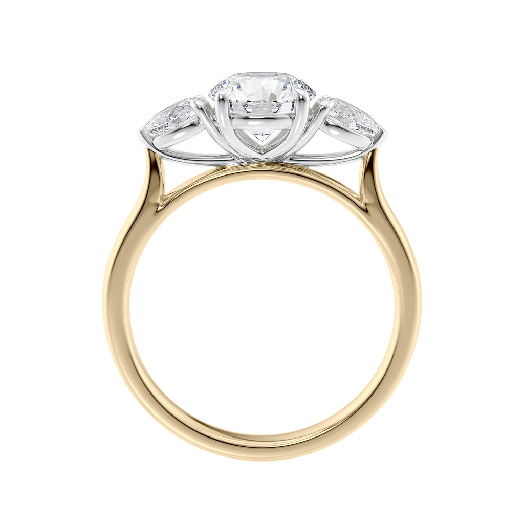 Round 3 stone natural diamond engagement ring with pear shoulders in gold side view.