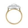 Round 3 stone natural diamond engagement ring with pear shoulders in gold side view.
