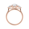 Round 3 stone natural diamond engagement ring with pear shoulders in rose gold side view.