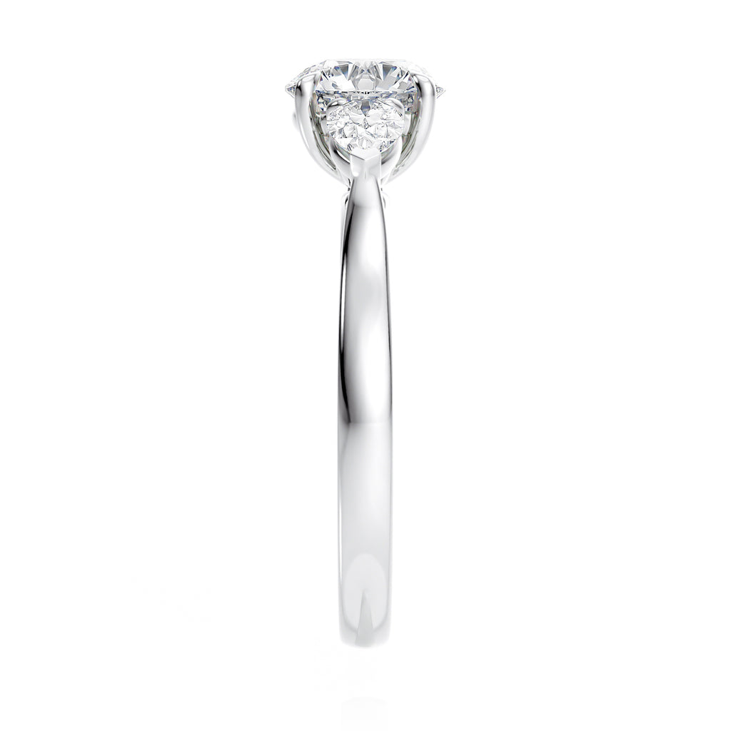 Round 3 stone natural diamond engagement ring with pear shoulders in white gold end view.