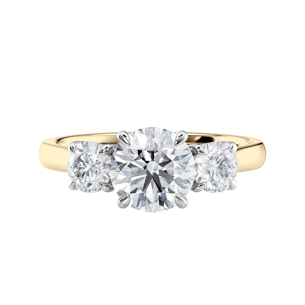 Round brilliant cut 3 stone diamond engagement ring 18ct gold  and platinum front view.