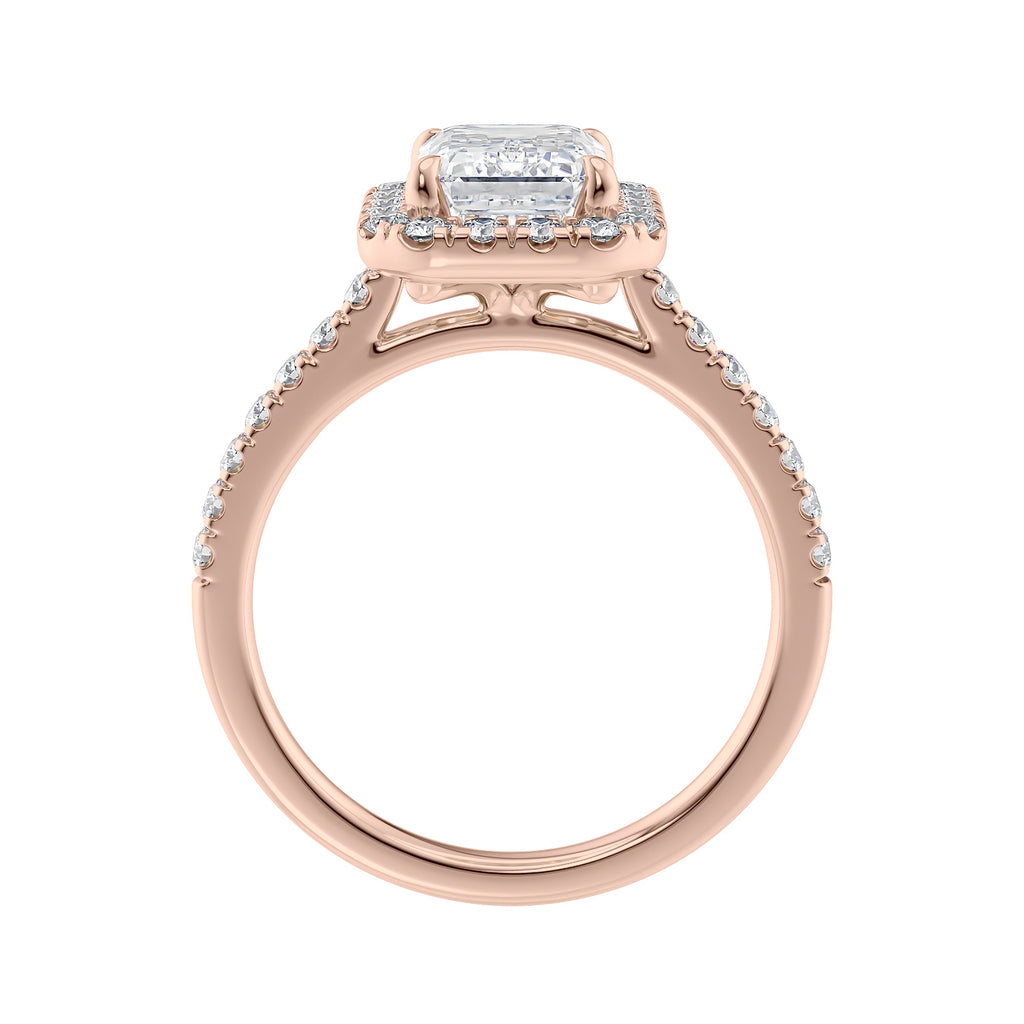 Emerald cut halo lab grown diamond engagement ring with castle set diamond set band 18ct rose gold side view.