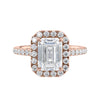 Emerald cut halo lab grown diamond engagement ring with castle set diamond set band 18ct rose gold front view.