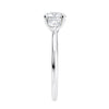 Round brilliant cut diamond 3 stone engagement ring with small side diamonds white gold end view.